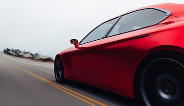 Red car driving down road to promote ILSAC GF-7 presee release